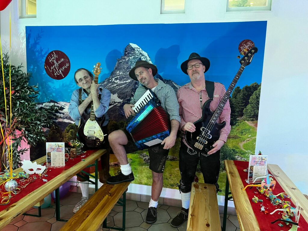 Oktoberfest Trio performing traditional Bavarian music at Alpina Hotel